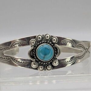 Navajo sterling silver cuff bracelet with turquoise and etched designs
